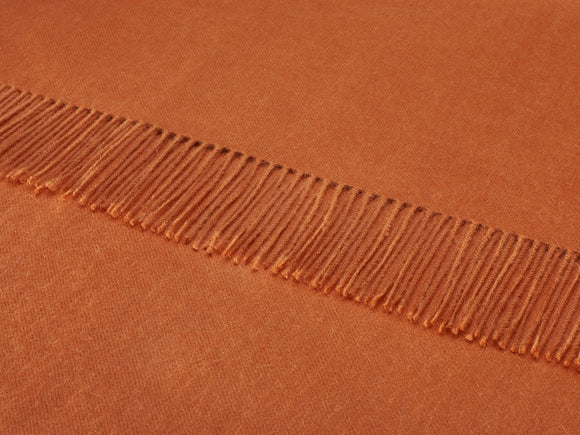 plain terracotta throw blanket made from alpaca by bronte moon